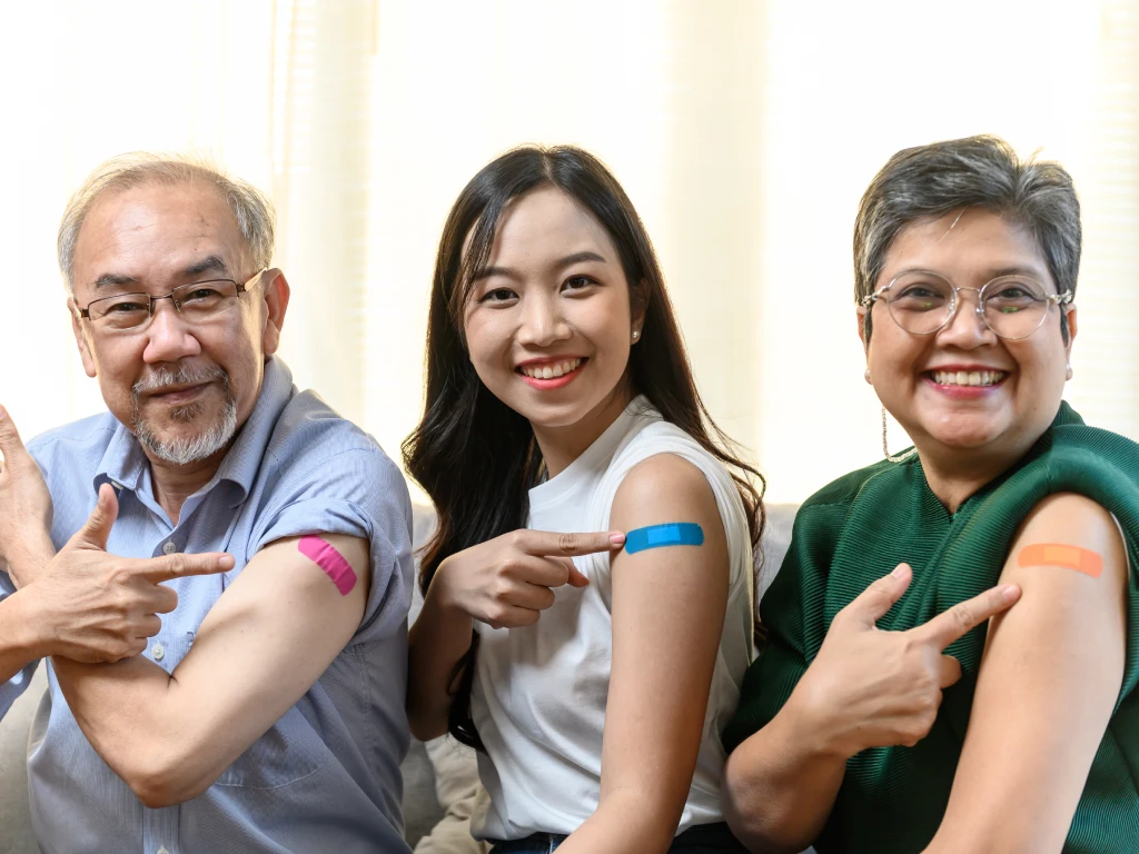 Adults receiving vaccinations under Singapore’s vaccination programme