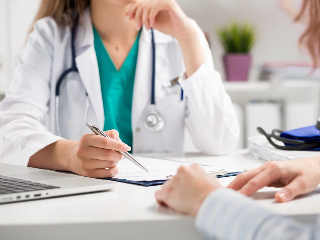 Doctor discussing thyroid function test results with a patient